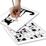 A close-up of a woman’s hand holding a pencil, carefully completing a grid drawing puzzle of a cat. The completed cat drawing is visible above the hand, with the corresponding grid template below it for reference.